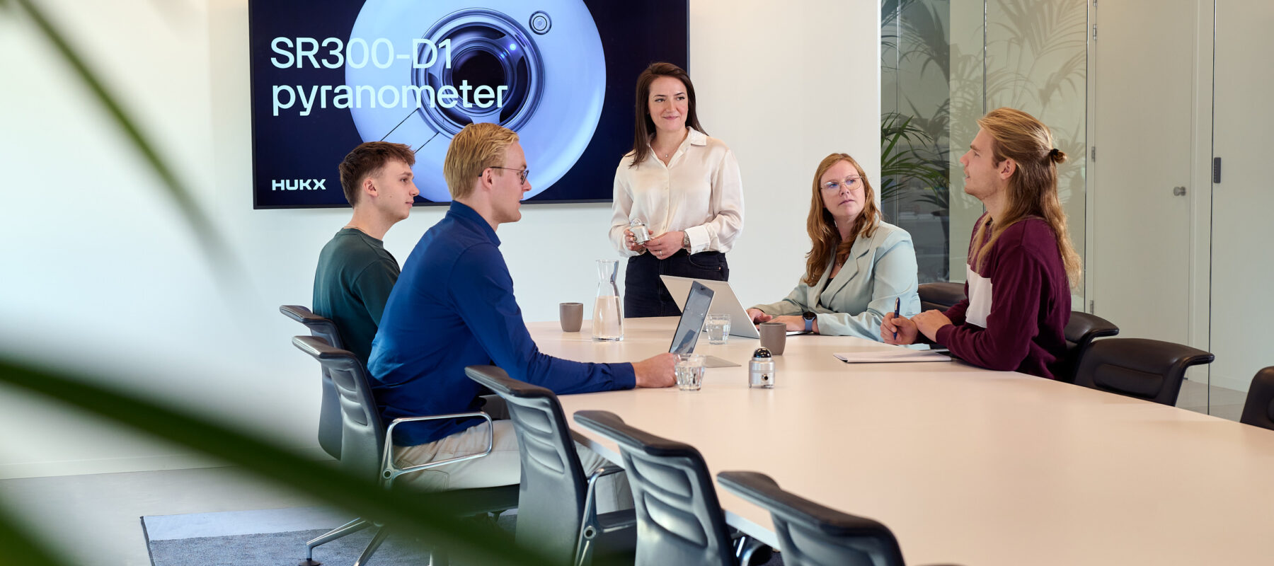 Hukx employees meeting in office setting