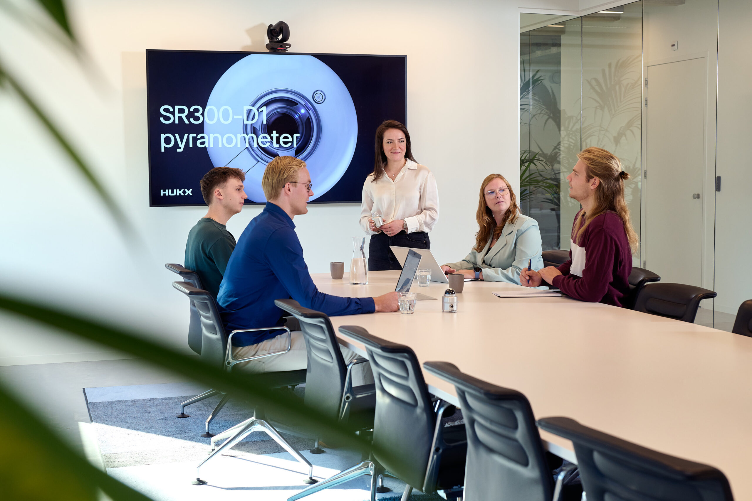 Hukx employees meeting in office setting